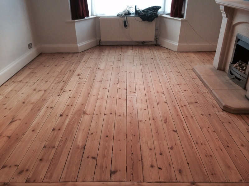 Herringbone parquet floor restored to golden finish