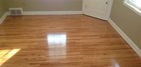 Light wooden floor in empty room