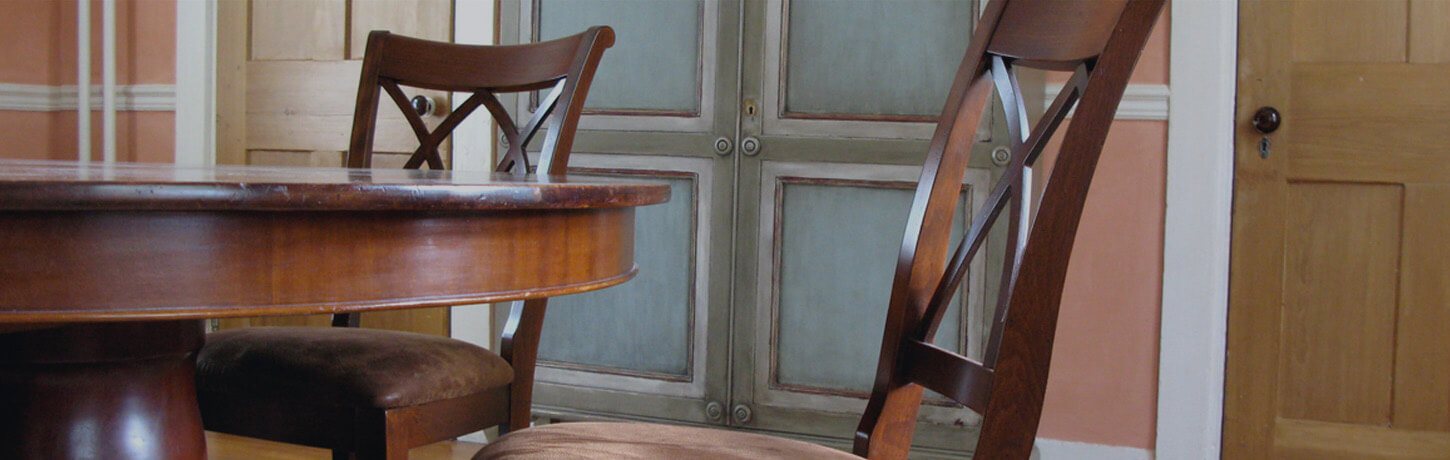 Wooden dining table and chairs close-up